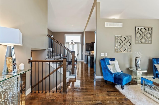 4108 NW 76th St, Kansas City, MO 64151 - foyer with wood finished floors, a chandelier, and baseboards