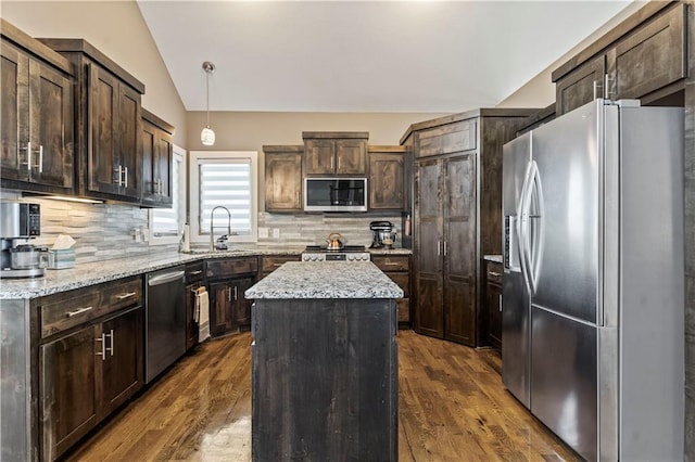 4108 NW 76th St, Kansas City, MO 64151 - kitchen with appliances with stainless steel finishes, lofted ceiling, a sink, a kitchen island, and dark brown cabinets