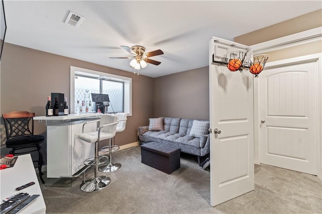 4108 NW 76th St, Kansas City, MO 64151 - living area featuring light carpet, a ceiling fan, and baseboards