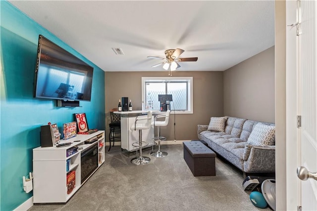 4108 NW 76th St, Kansas City, MO 64151 - living area with a ceiling fan, carpet floors, and baseboards