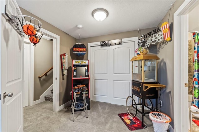 4108 NW 76th St, Kansas City, MO 64151 - playroom featuring carpet floors, baseboards, and a textured ceiling
