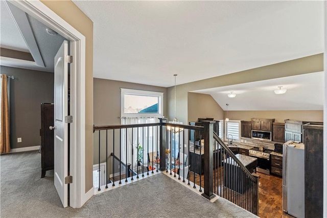 4108 NW 76th St, Kansas City, MO 64151 - corridor featuring an upstairs landing, healthy amount of natural light, a chandelier, and baseboards