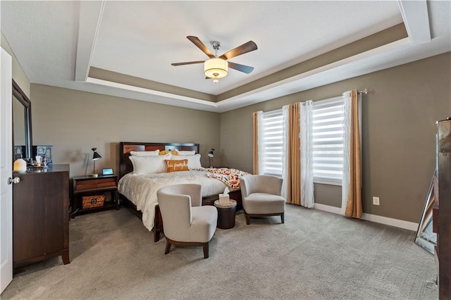 4108 NW 76th St, Kansas City, MO 64151 - bedroom featuring a tray ceiling, carpet floors, baseboards, and ceiling fan