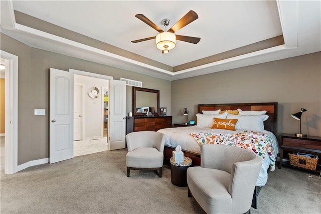 4108 NW 76th St, Kansas City, MO 64151 - bedroom with carpet flooring, a tray ceiling, baseboards, and a ceiling fan
