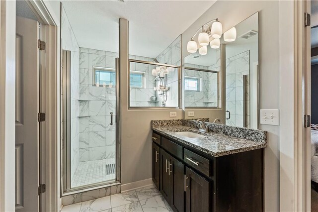 4108 NW 76th St, Kansas City, MO 64151 - full bath with marble look tiles, a stall shower, vanity, and baseboards