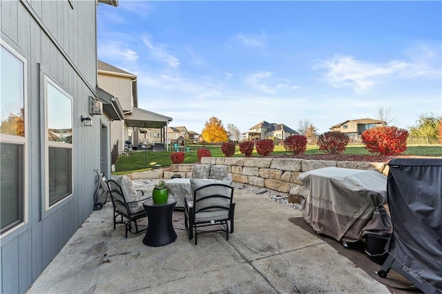 4108 NW 76th St, Kansas City, MO 64151 - view of patio with a residential view, fence, and outdoor dining space