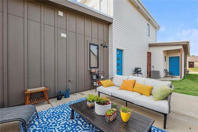 view of patio with an outdoor living space and central air condition unit