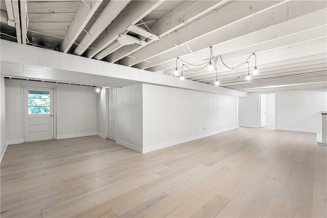 218 NW 43rd Ter, Kansas City, MO 64116 - below grade area with wood finished floors and baseboards