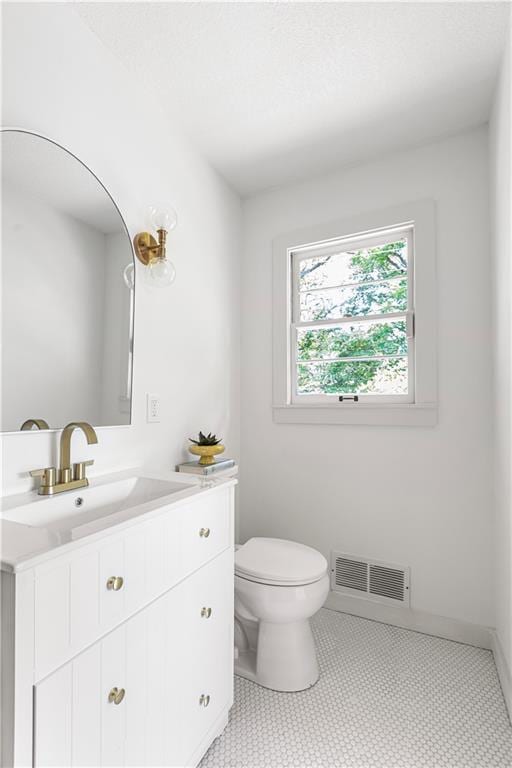 218 NW 43rd Ter, Kansas City, MO 64116 - bathroom featuring toilet and vanity