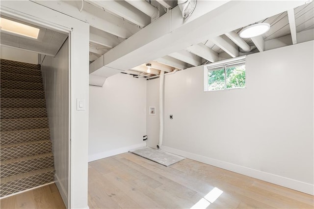 218 NW 43rd Ter, Kansas City, MO 64116 - below grade area featuring light wood finished floors and baseboards