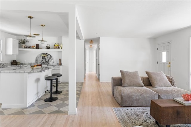 218 NW 43rd Ter, Kansas City, MO 64116 - living area featuring light wood-style flooring