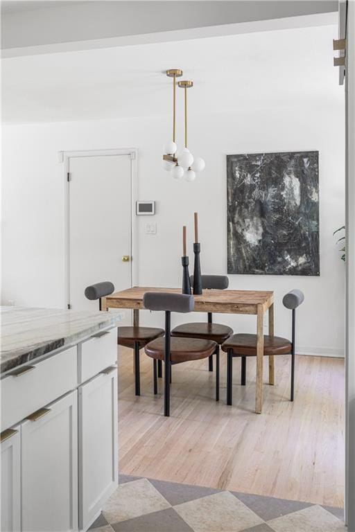 218 NW 43rd Ter, Kansas City, MO 64116 - dining area featuring light wood-style flooring