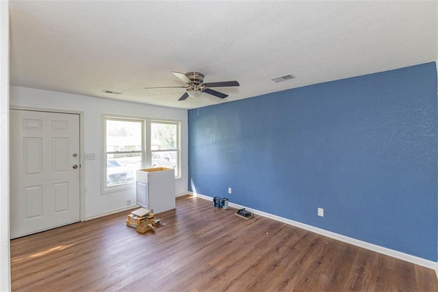 6021 E 151st Ter, Grandview, MO 64030 - spare room with ceiling fan, wood finished floors, and baseboards