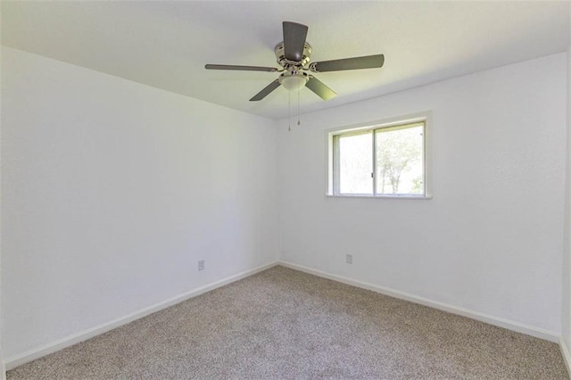 6021 E 151st Ter, Grandview, MO 64030 - carpeted spare room featuring baseboards and a ceiling fan