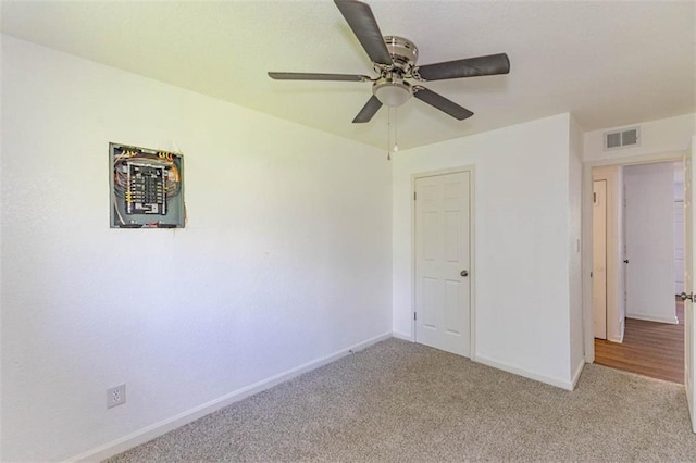 6021 E 151st Ter, Grandview, MO 64030 - carpeted empty room featuring a ceiling fan and baseboards