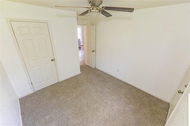6021 E 151st Ter, Grandview, MO 64030 - carpeted empty room featuring a ceiling fan and baseboards