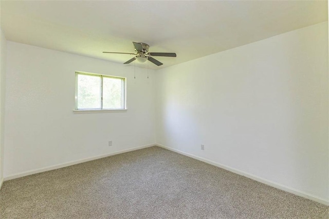 6021 E 151st Ter, Grandview, MO 64030 - unfurnished room featuring light colored carpet, a ceiling fan, and baseboards