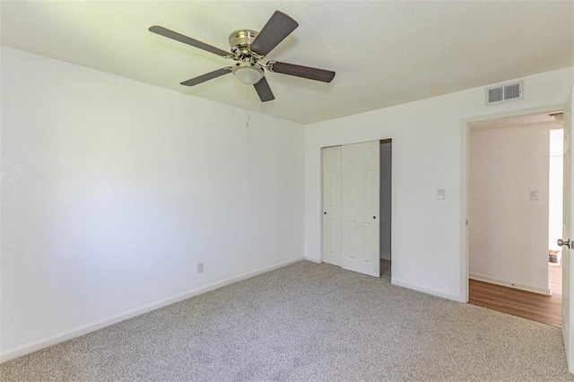 6021 E 151st Ter, Grandview, MO 64030 - unfurnished bedroom featuring carpet, baseboards, a closet, and ceiling fan