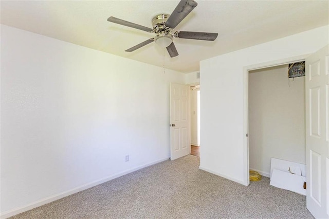 6021 E 151st Ter, Grandview, MO 64030 - unfurnished bedroom with light colored carpet, baseboards, a ceiling fan, and a closet