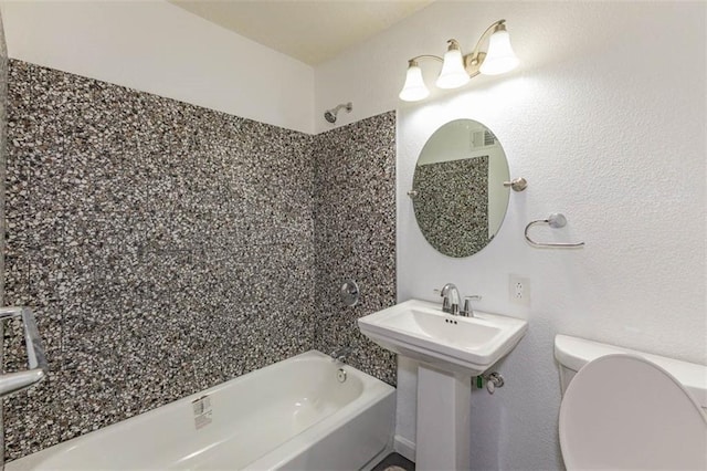 6021 E 151st Ter, Grandview, MO 64030 - bathroom featuring shower / bath combination and toilet