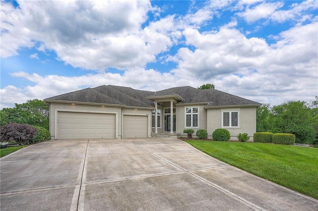 205 SE Hackamore Dr, Lees Summit, MO 64082 - view of front of property with stucco siding, a garage, driveway, and a front lawn