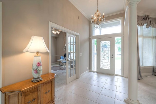 205 SE Hackamore Dr, Lees Summit, MO 64082 - foyer entrance with ornamental molding, baseboards, a chandelier, light tile patterned floors, and ornate columns
