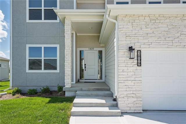 entrance to property with an attached garage