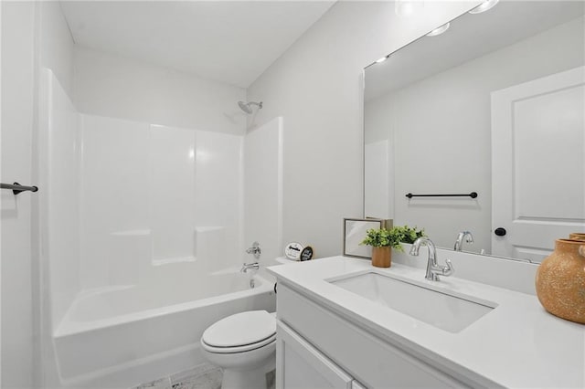 bathroom featuring toilet, vanity, and bathing tub / shower combination