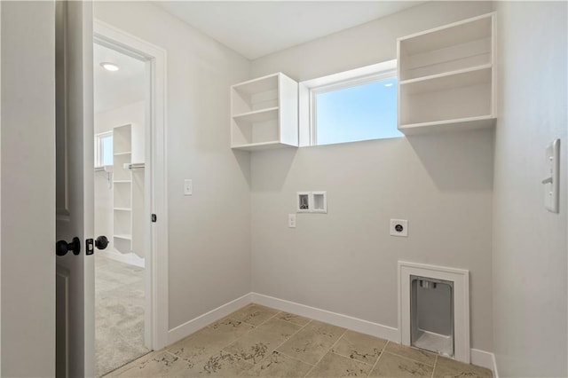 laundry area featuring hookup for an electric dryer, washer hookup, and baseboards