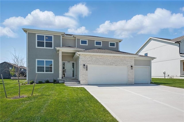 prairie-style home with an attached garage, driveway, and a front yard