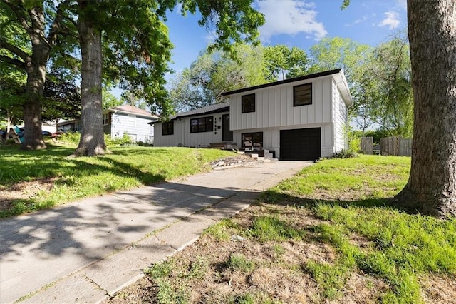 split level home with a garage and driveway