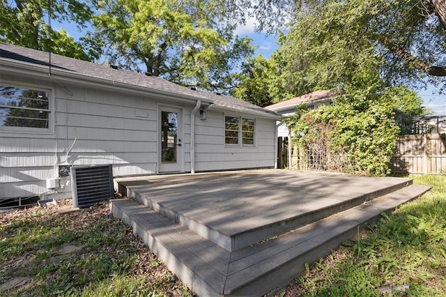wooden deck with fence and central AC unit