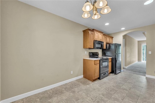 kitchen with black appliances, arched walkways, baseboards, light countertops, and a chandelier