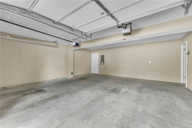 garage with electric panel and a garage door opener