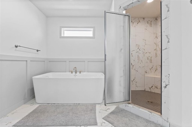 19623 W 196th Ter, Spring Hill, KS 66083 - full bathroom featuring a decorative wall, marble tiled floors, a marble finish shower, a freestanding bath, and a wainscoted wall