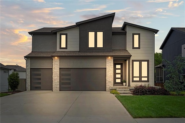 15932 W 171st Ter, Olathe, KS 66062 - contemporary house featuring stone siding, an attached garage, driveway, a yard, and a shingled roof