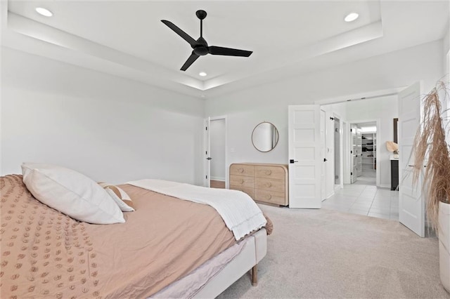 15932 W 171st Ter, Olathe, KS 66062 - tiled bedroom featuring a tray ceiling, recessed lighting, carpet, ceiling fan, and baseboards
