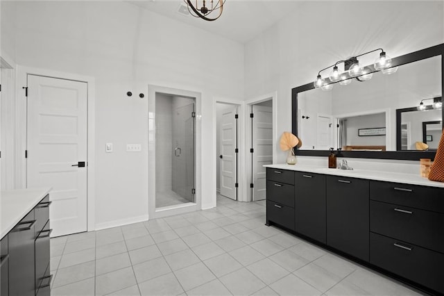 15932 W 171st Ter, Olathe, KS 66062 - bathroom featuring vanity, a shower stall, tile patterned floors, baseboards, and a closet