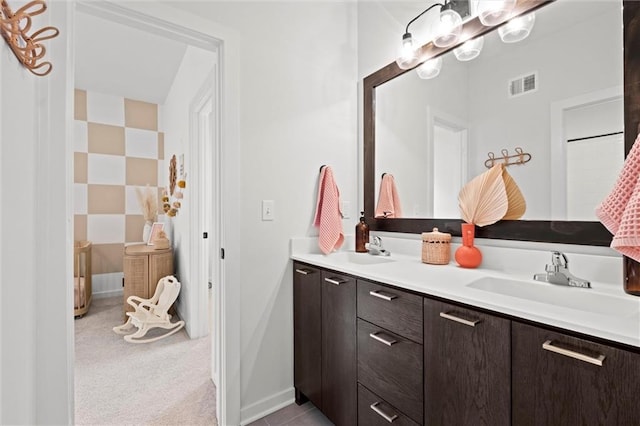 15932 W 171st Ter, Olathe, KS 66062 - bathroom with double vanity, baseboards, and a chandelier