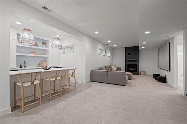 15932 W 171st Ter, Olathe, KS 66062 - living area featuring light colored carpet, recessed lighting, baseboards, and a fireplace