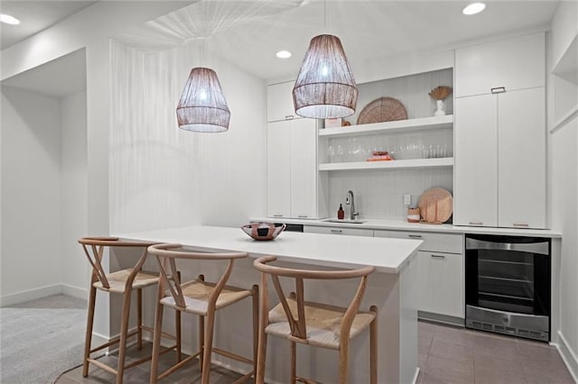 15932 W 171st Ter, Olathe, KS 66062 - indoor bar featuring beverage cooler, pendant lighting, baseboards, recessed lighting, and tile patterned flooring