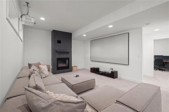 15932 W 171st Ter, Olathe, KS 66062 - cinema room featuring carpet flooring, recessed lighting, a fireplace, and baseboards