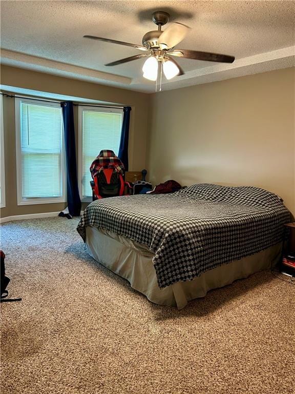 102 Willow Pt, Lansing, KS 66043 - carpeted bedroom featuring a textured ceiling and a ceiling fan