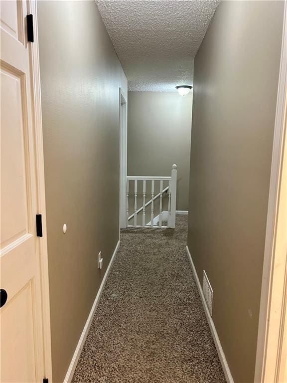 102 Willow Pt, Lansing, KS 66043 - corridor with a textured ceiling, an upstairs landing, carpet flooring, and baseboards