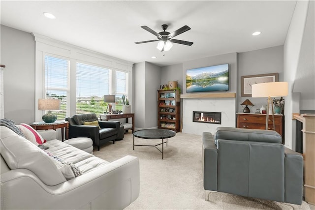 16966 S Durango St, Olathe, KS 66062 - carpeted living area with a ceiling fan, a glass covered fireplace, and recessed lighting