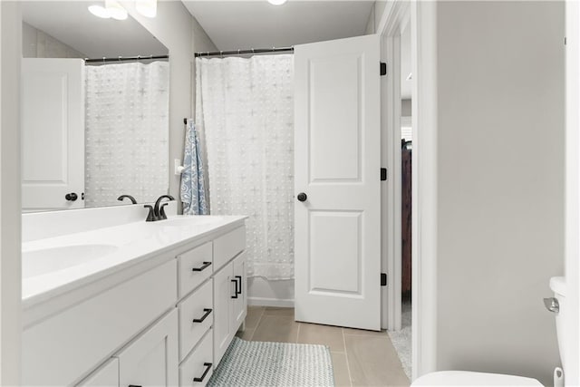 16966 S Durango St, Olathe, KS 66062 - full bathroom featuring tile patterned floors, toilet, and double vanity