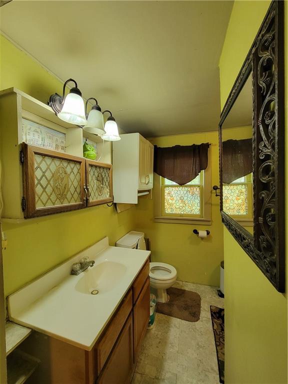 111 S Wall St, Leeton, MO 64761 - bathroom with toilet and vanity