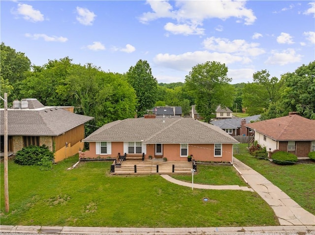 2532 N 73rd St, Kansas City, KS 66109 - view of front facade with a front yard and stucco siding