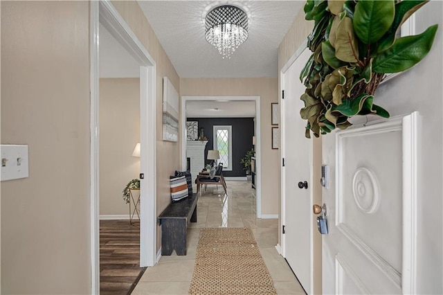 2532 N 73rd St, Kansas City, KS 66109 - entryway with baseboards and a chandelier