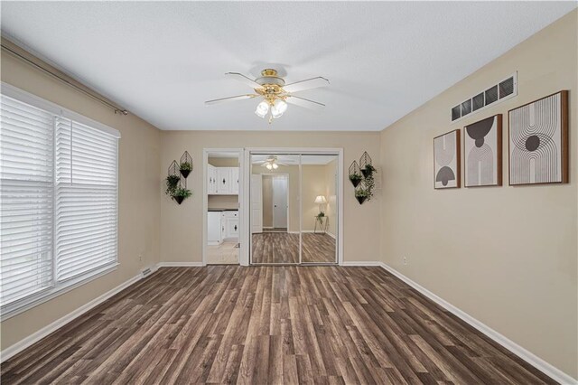 2532 N 73rd St, Kansas City, KS 66109 - unfurnished living room with a ceiling fan, wood finished floors, and baseboards